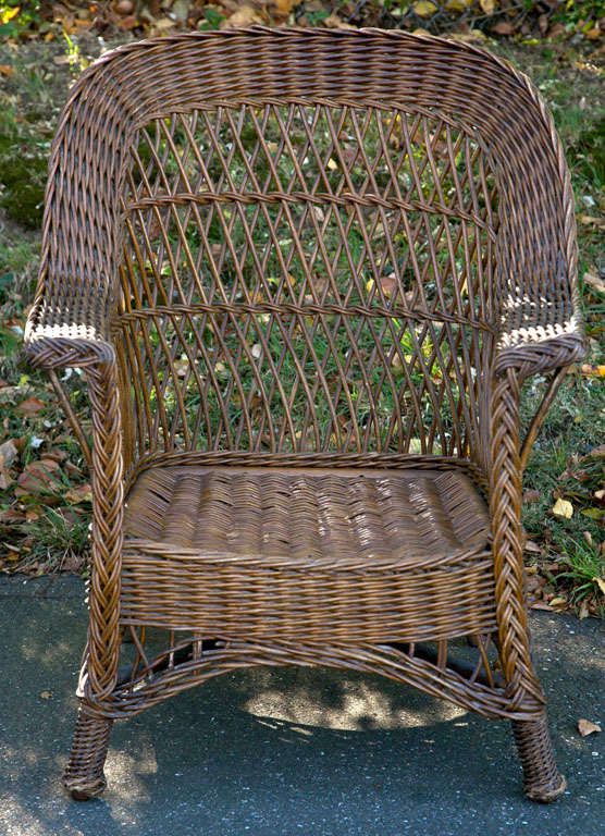 Wicker Rocker in natural original finish with woven seat and feet.  38