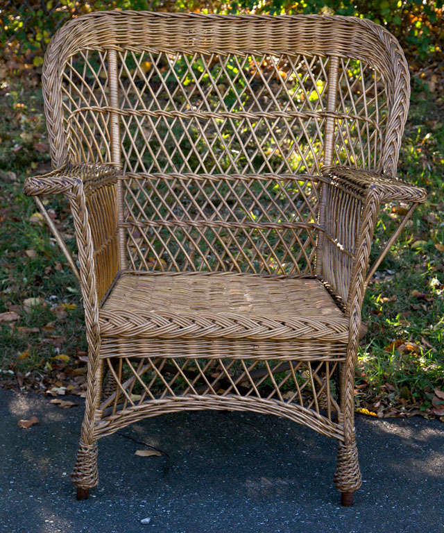 Bar Harbor wicker chair with woven seat and feet in original natural finish.  Beautiful large winged back.