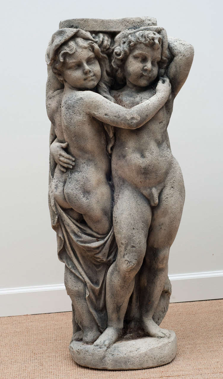 American Pair of  Embracing Putti Stone figures For Sale