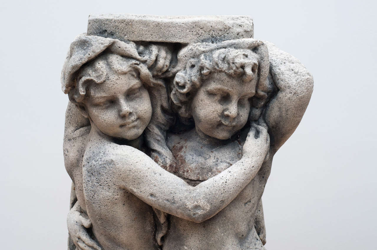 20th Century Pair of  Embracing Putti Stone figures For Sale