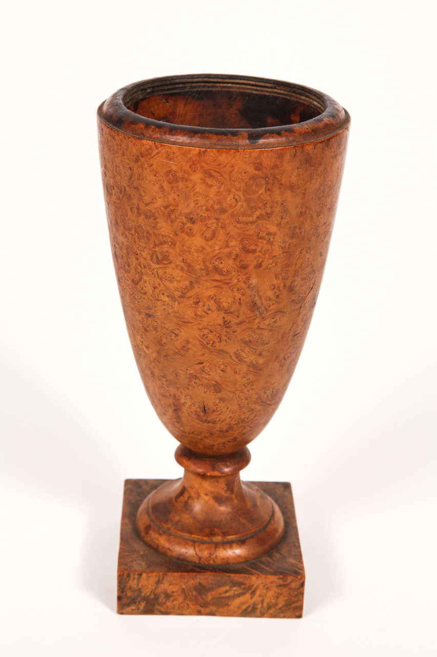 Tapered urn with square based with turned pedestal.