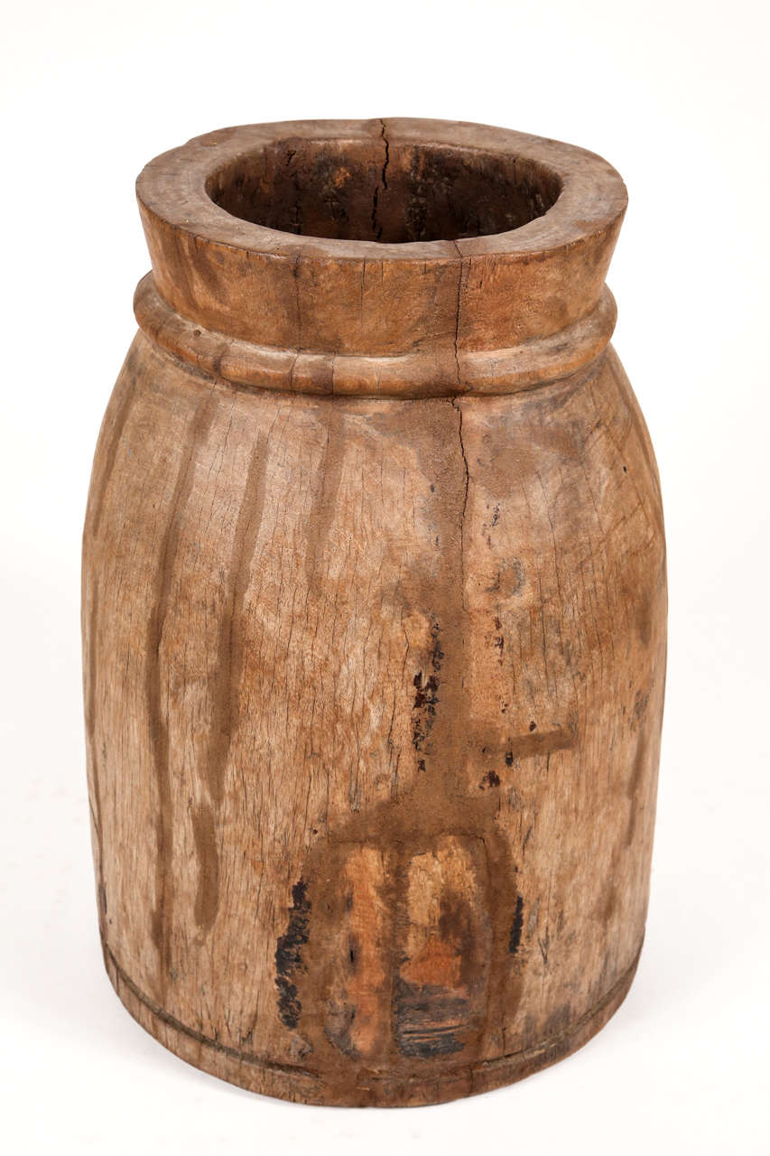 Rustic wooden urn for indoor or outdoor use.