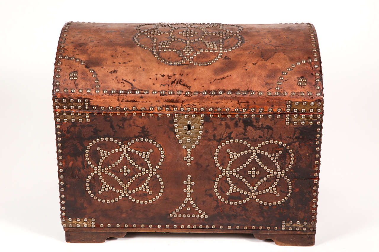 Naturally distressed leather with nailhead details.  Original brass hardware.