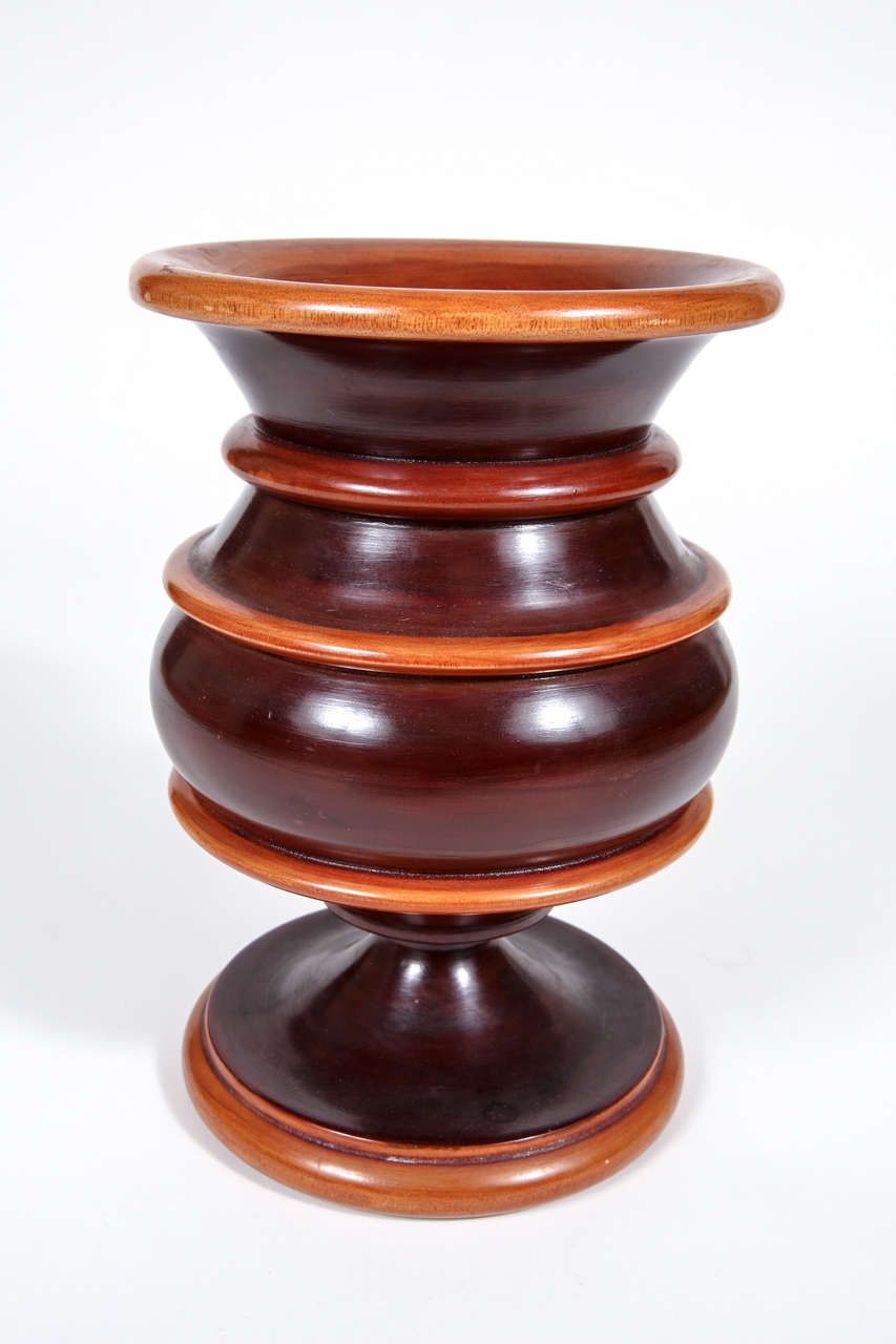 Two-toned turned wooden vase.
