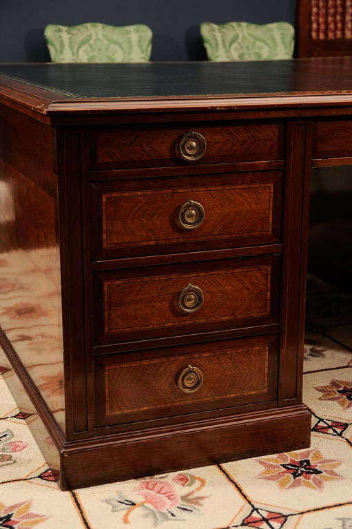 Handsome French Kingwood and Mahogany Partner's Desk. Of rectangular outline, each side with an apron drawer and four further short drawers flanking the kneehole.