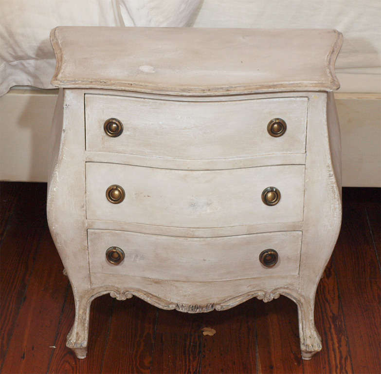 Beautiful pair of swedish style nighstands painted in tones of greys and whites with detailed carvings on legs.