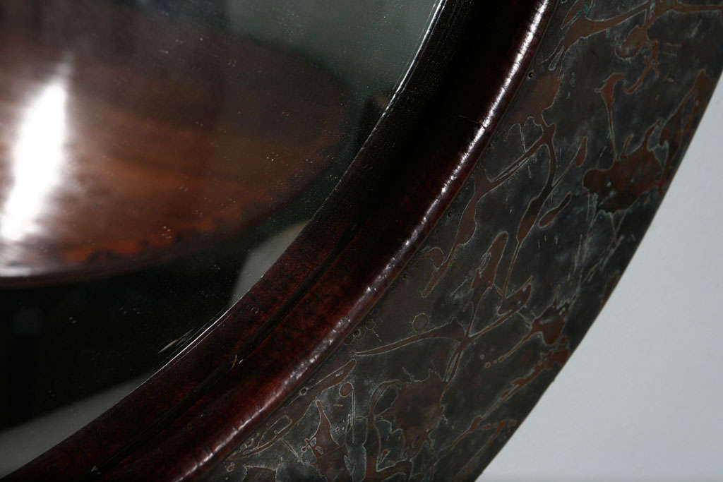 large copper round mirror