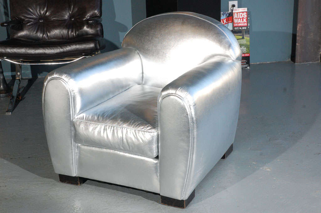 1950s pair of French armchairs upholstered with Italian silver metallic leather design by Jacques Adnet 
(Also sofa available).