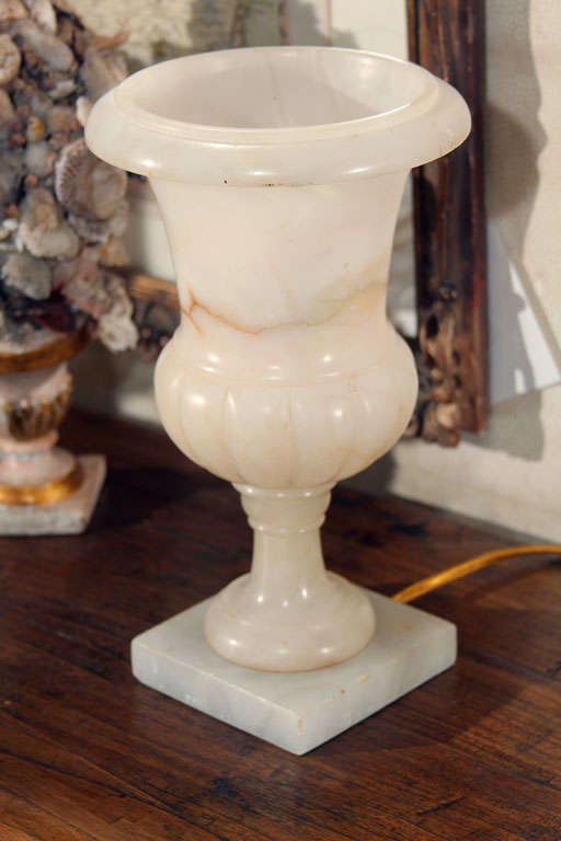 A vintage alabaster urn lamp from the 1930”s or 1940”s. Purchased in the Paris Flea market and recently re-wired for the US market.