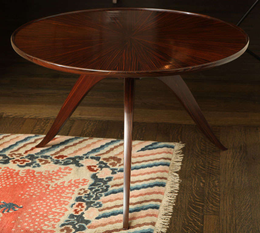 An elegant Macassar ebony tripod table with wood grain pattern radiating from the center on tabletop by Emile Jacques Ruhlmann (1879-1933).

Stamped: Ruhlmann, 1933 & B in a circle (for Atelier B)

Literature:
Florence Camard, Ruhlmann: Master