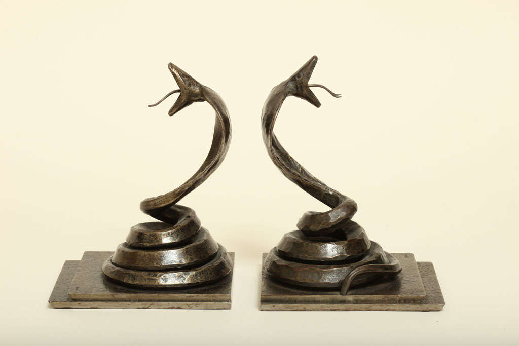 Fine wrought iron cobra bookends on a stepped rectangular base with a rich dark brown patina by Edgar Brandt (1875-1968).
Signed: 