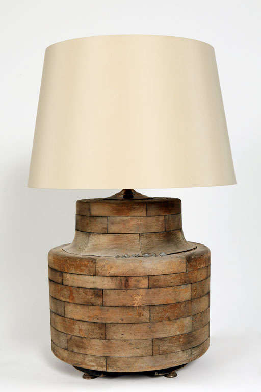 Wooden form, numbered, and believed to have been an operational gear that turned a belt. Newly wired as a lamp, with a hard silk, tapered drum shade.
