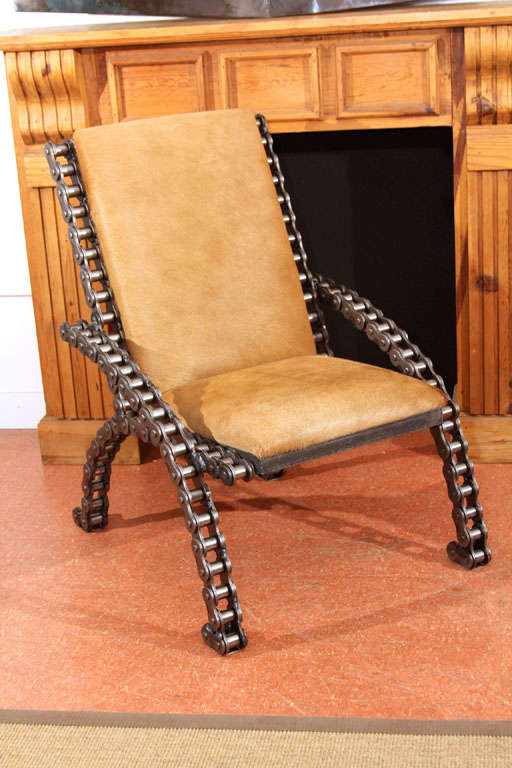 Inspired by a vintage original found in Texas, we've created our own interpretation here using new industrial roller chain in a playful design.  Professionally welded in a pleasing silhouette which perfectly balances the rugged materials, this bold