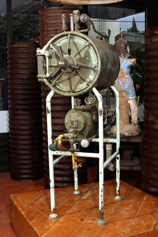 Early copper and steel autoclave sterilizer used for various medical or veterinary instrument sterilization.
