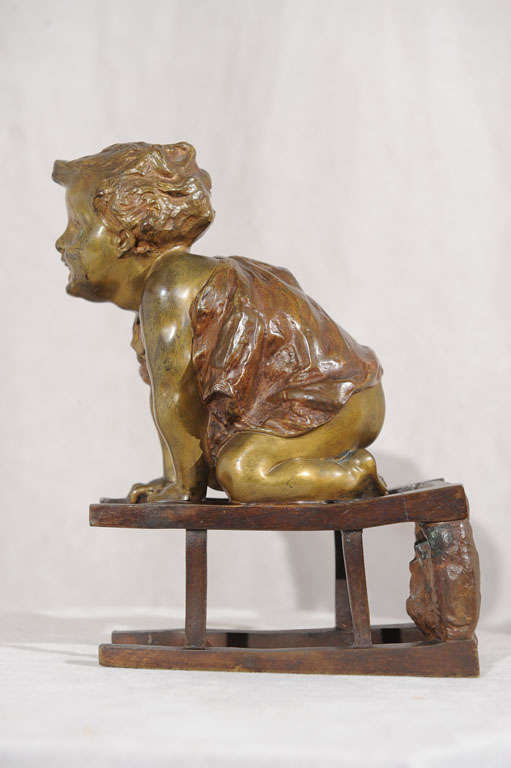 Folk Art Bronze Statue of Toddler Climbing on Chair by Juan Clara ca. 1900 For Sale