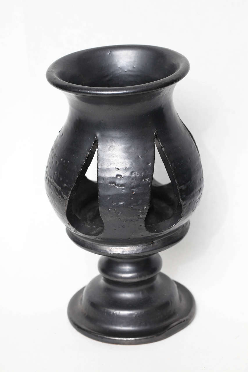 Glazed with black luster finish. Signed on underside.

Jean Marais was the muse and one time partner of Jean Cocteau. In 1973, he moved to the town of Vallauris, known for its clay, and soon began experimenting with pottery.