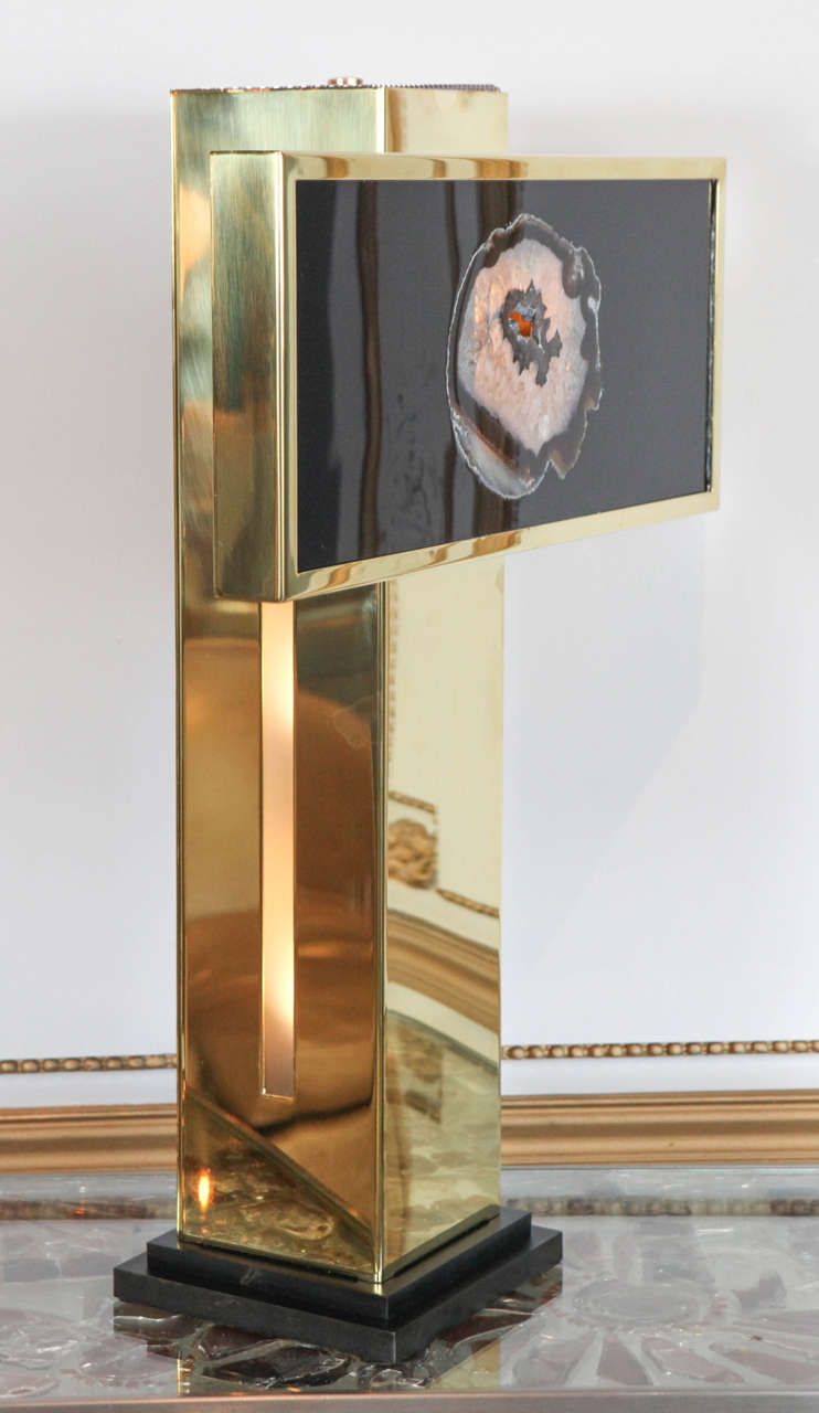 We have two lamps available off the floor. 
Beautiful brass and resin with an agate inclusion table lamp designed by Adam Thomas Hebb. His work with resin, agate/ ammonite and/or stone make each of his pieces a little unique jewel. They are