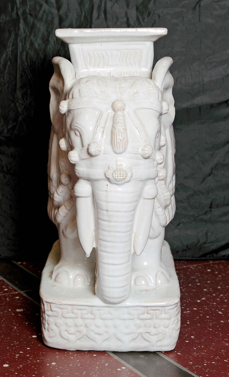 Pair of white glazed ceramic elephant tables.