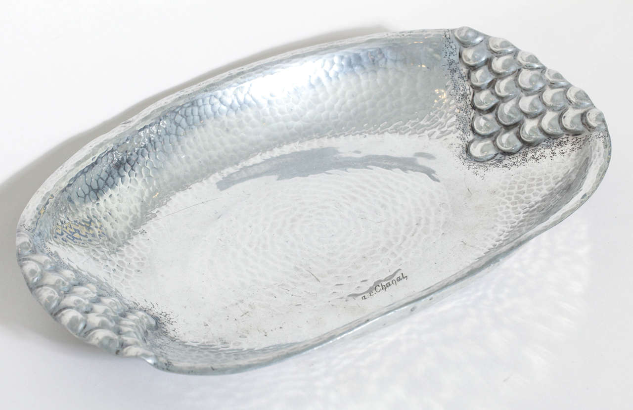 Hand-wrought dinanderie maillechort martele´ oval coupe with triangles made up of hemispheres on each end.

Signed: a.e. Chanal

(Price shown is reduced price, no further trade discount) 