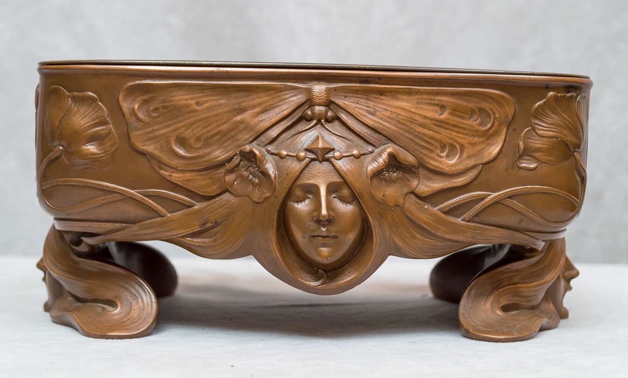 We are always searching for good Art Nouveau. This planter is certainly one of our best recent finds. It has all the elements that make Art Nouveau so alluring. Sinewy lines, cameo faces, and great design. It almost feels like a Mucha print. The