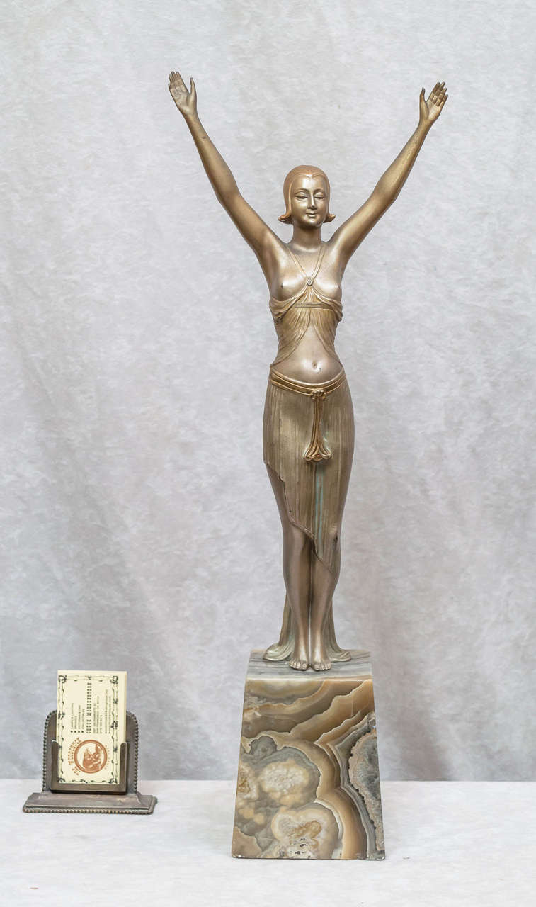This very graceful and sleek model of a young women is signed by Henry Fugere, a well listed artist. Mr. Fugere was born in 1872 and exhibited in Paris at the salon for several years. Many fine examples of his work are shown in ''Art Deco and other