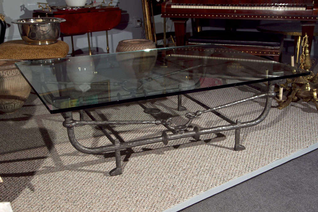 Art deco glass Top coffee table with metal base in the manner of Giocometti.