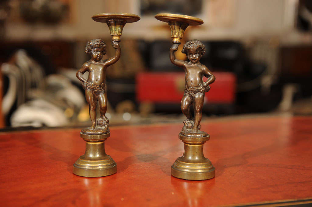 Pair of Patinated Bronze and Parcel Gilt Putti-form Candlesticks For Sale 2