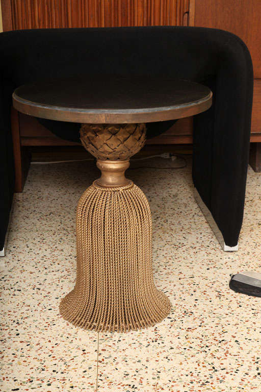 SOLD OCT 2012 Rich & elegant tassel base marble top table of exceptional antique gold patinated worked iron roping with a tole pineapple artichoke motif neck.  Thick black marble inset top.  Instantly elegant.  Gorgeous side table, end table.   We