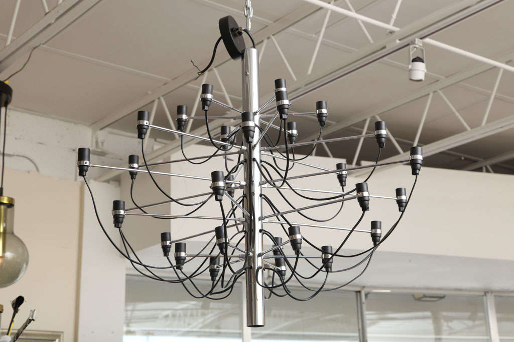 Original Flos chandelier; Stunning design by Gino Sarfatti. 
The chandelier is in perfect working condition and uses 30 max. 15 watts E14 light bulbs.
Marked at the top:  Flos, made in Italy.
These vintage piece is a true statement in design.