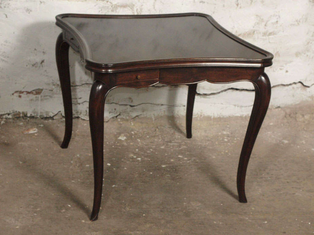 Spectacular 19th c. Louis XV game/card table that has been painstakingly restored down to the bare wood, walnut in this case. This little card table is gorgeous with its curved legs and table top. Made of solid walnut, the table is beautiful on its
