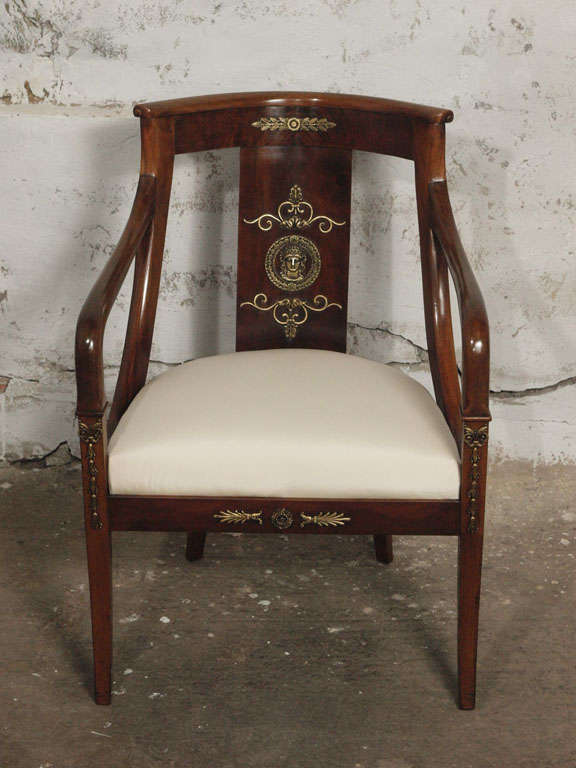These elegant period (Second Empire, Napoleon III) armchairs are simply exquisite.  Solid walnut construction with the original cast bronze ormolu medallions and acanthus leaves.  These chairs are beautiful examples of the elegance of the
