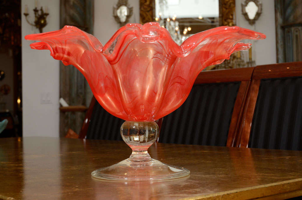 Absolutely magnificent and striking hand blown murano glass centerpiece or bowl of impressive size with swirls of coral red and clear glass.  Organic in shape with molded 