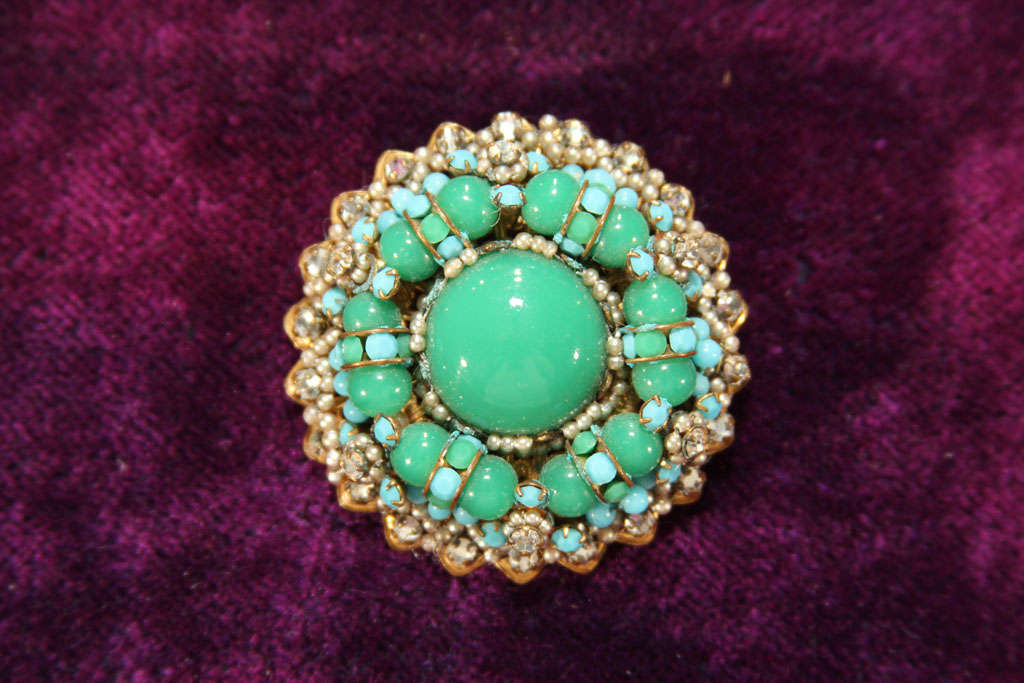 unmarked miriam Haskell pin in blue and green