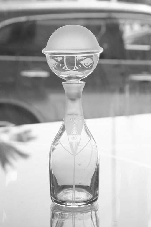 This all dressed up whimsical vintage glass man is ready to pour your liquor or water from the decanter. He is stenciled with frosted glass on the decanter front. His tie, bolo hat, and shirt are all in frosted glass. Great for a gift, or your bar.