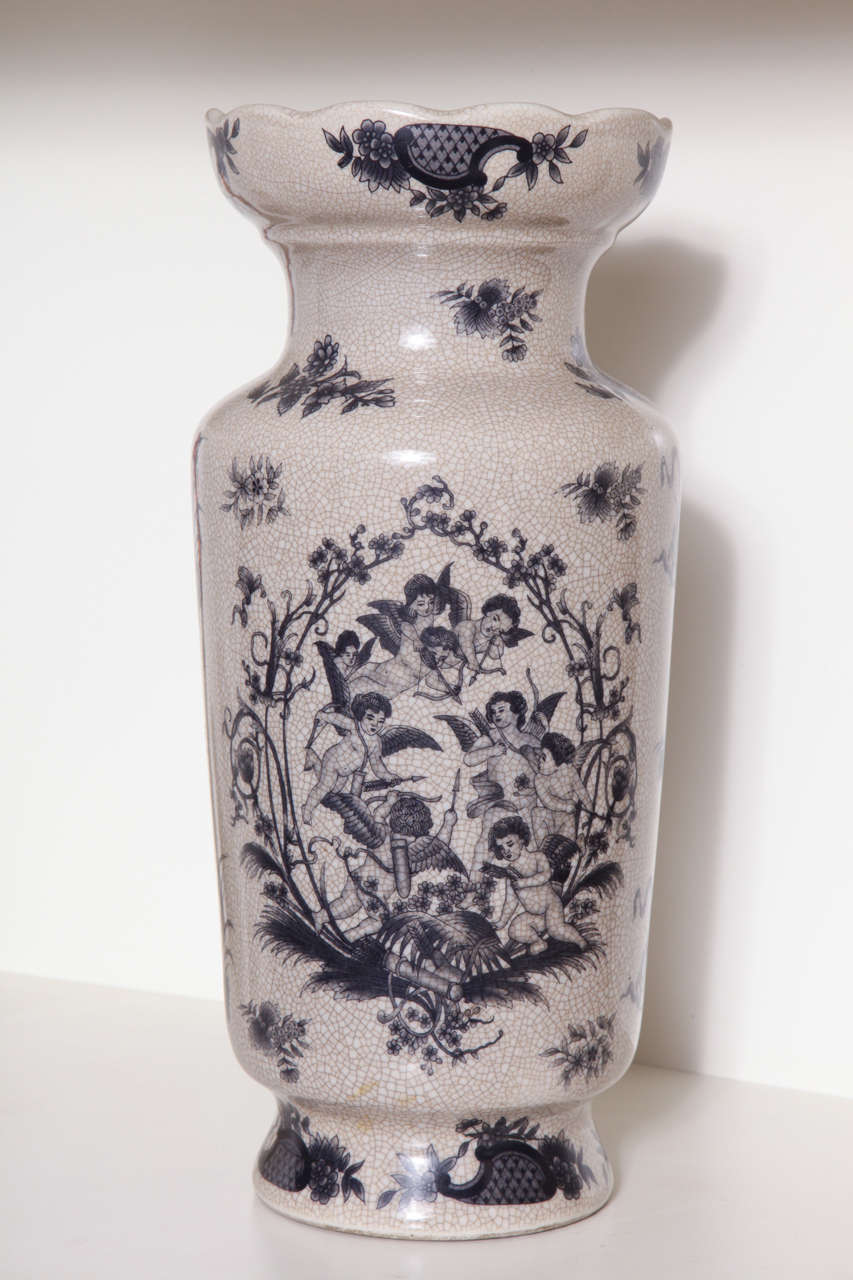 This beautiful  Overlay Cherubs Beige with Black Cupids Vase is a classical piece in every detail. 
It has tons of romantic attributs.
Perfect vase to enriched a classical space.