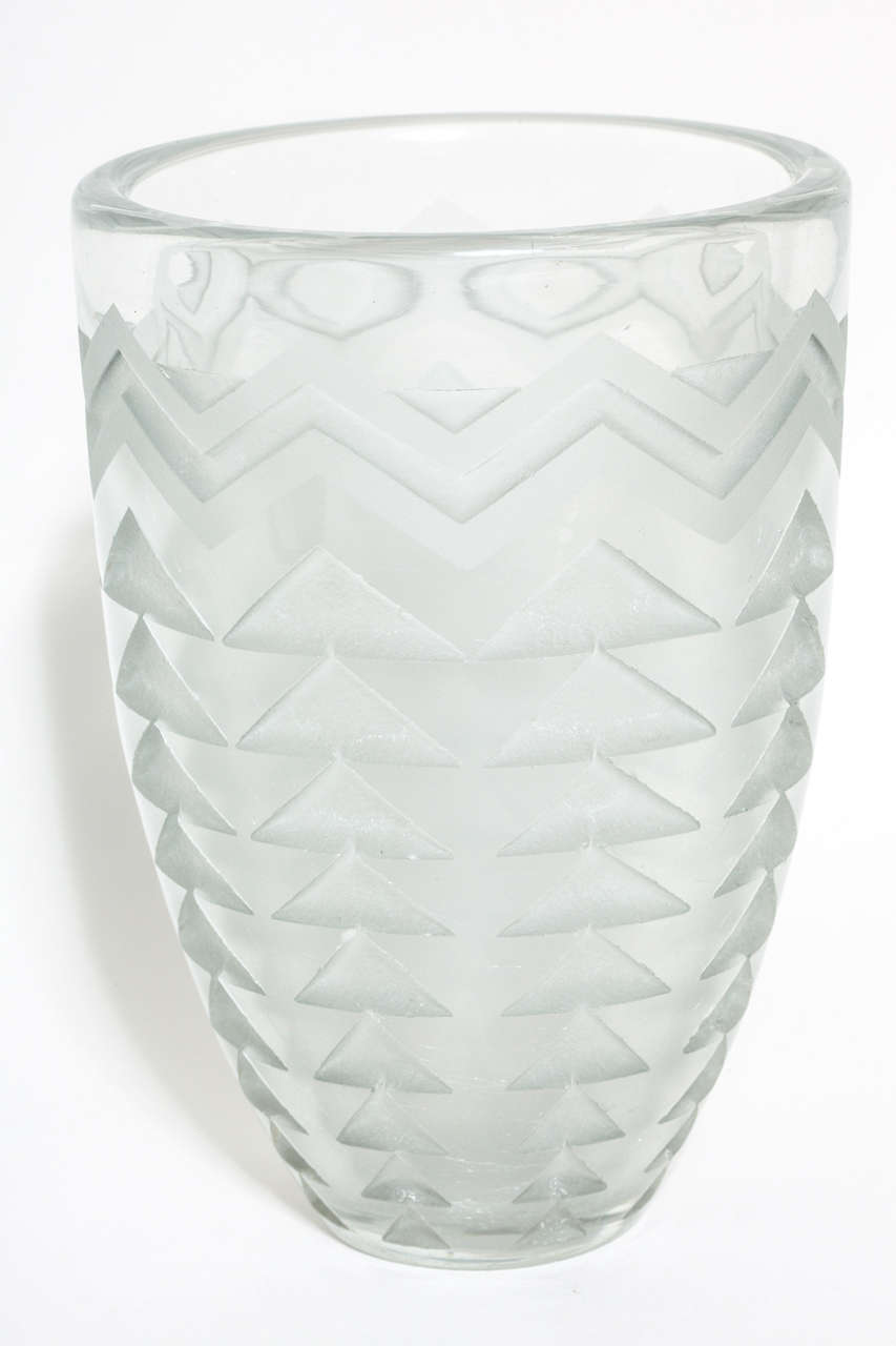 This vase has an etched triangle design with repeated decoration around the body.
Signed: artist's monogram

Jean Luce worked as a designer in a cubist-inspired style, rejecting the use of too much design and figurativeness in decoration. He