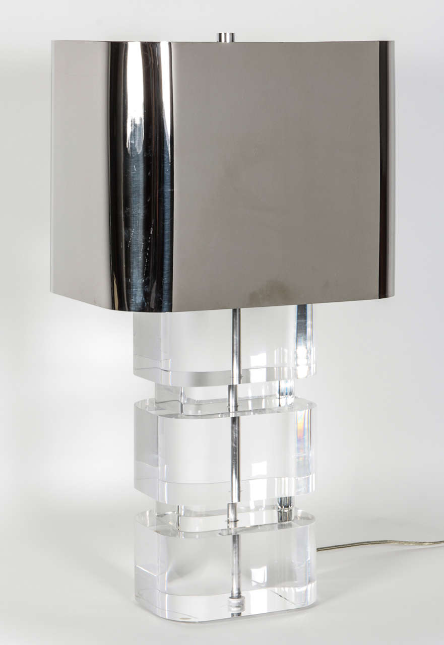 Pair of column lamps with original metal shades signed by Karl Springer. Beautifully crafted in thick lucite with a chrome stem center, with original, uniquely designed, substantial metal shades, double sockets and adjustable height (26 to 31