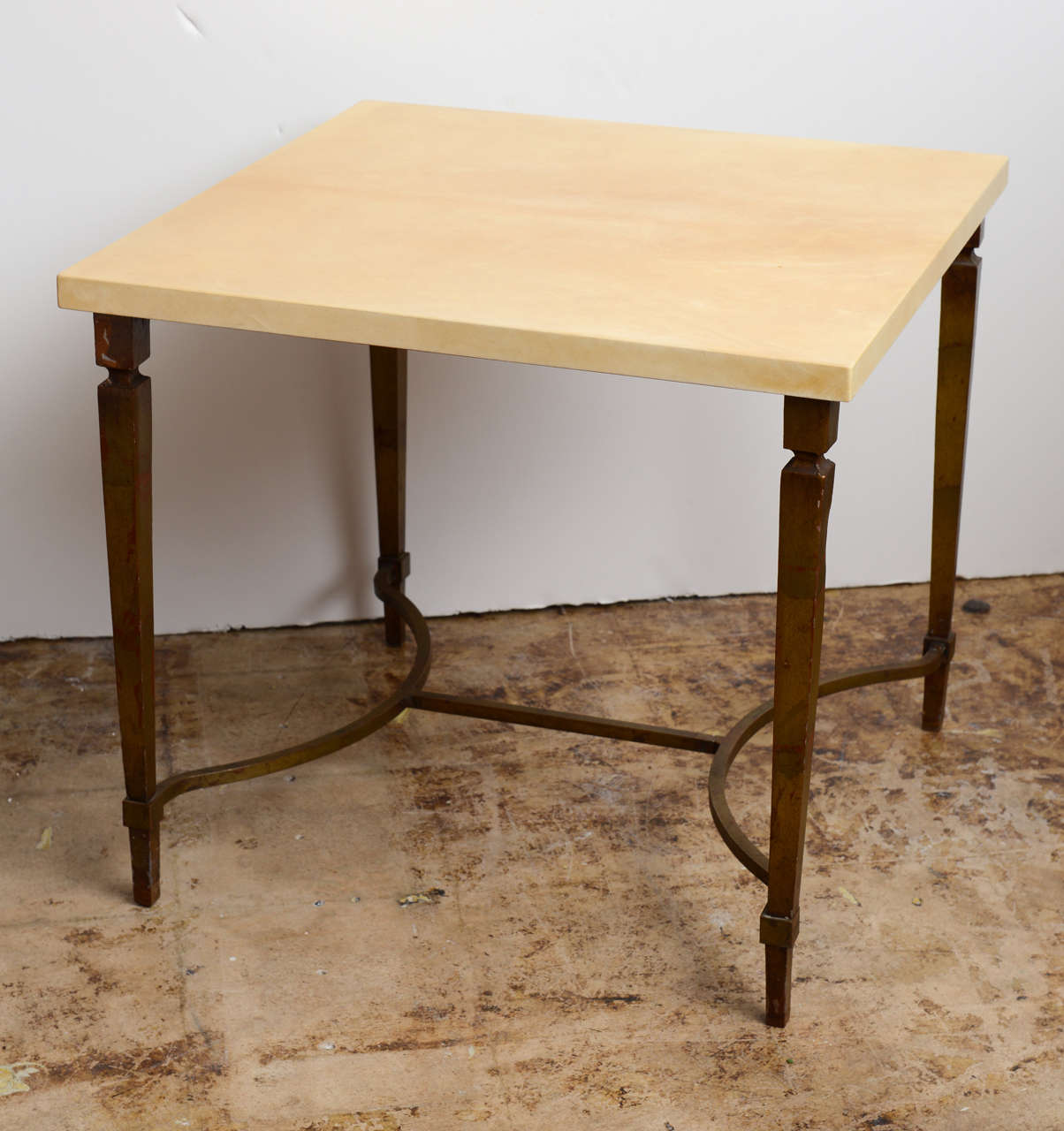Beautifull classic Goatskin Table by Italian Designer Aldo Tura . This table dates back to the 1960,s and it is in excellent condition. The metal  legs have a stunning Gold leaf patina . Great timeless vintage  piece .