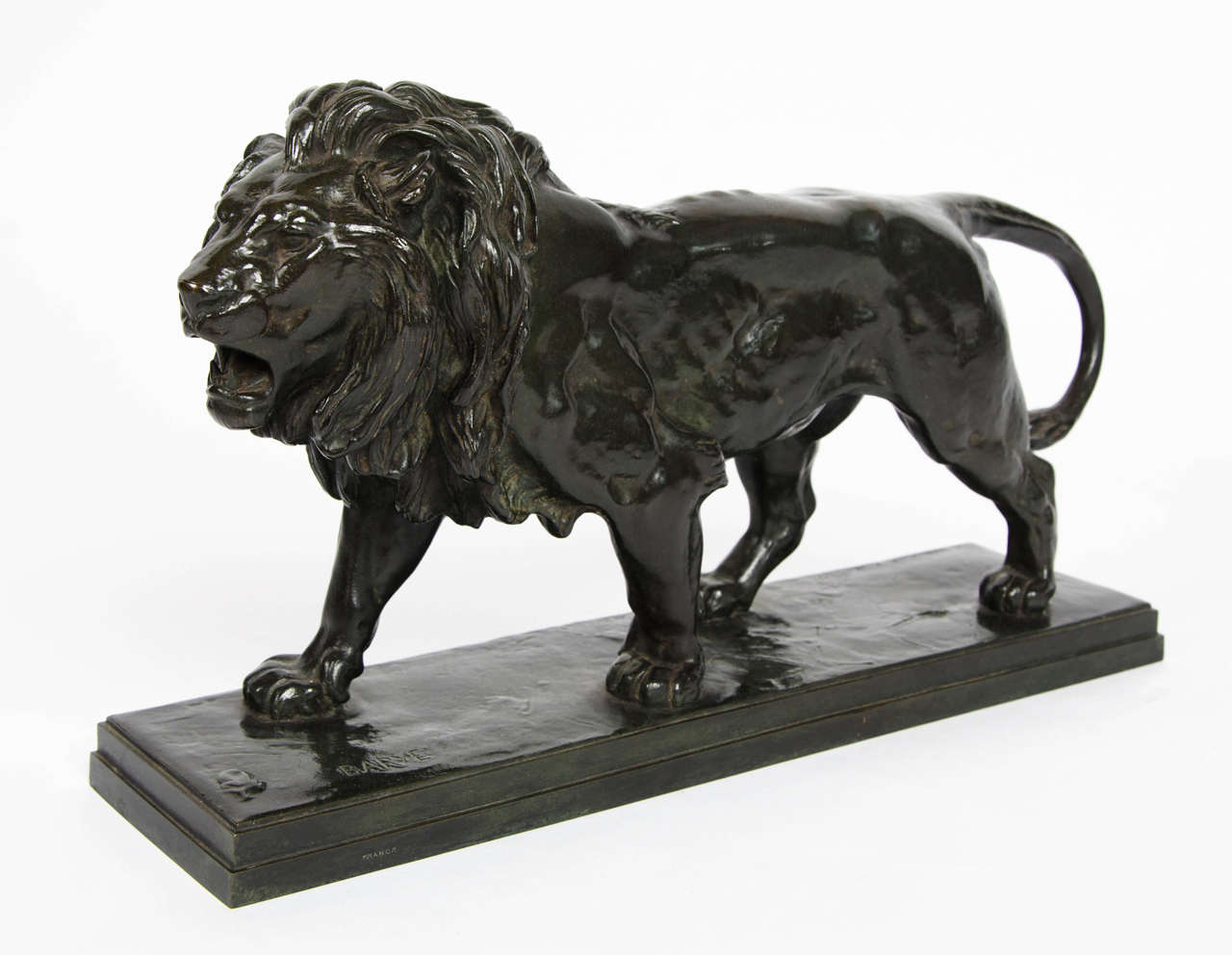 Lion rugissant by Antoine Louis Barye (1796-1875). A strong green brown patinated study of a lion in mid roar.

Excellent musculature and characterization. Stunning original condition.

Signed 