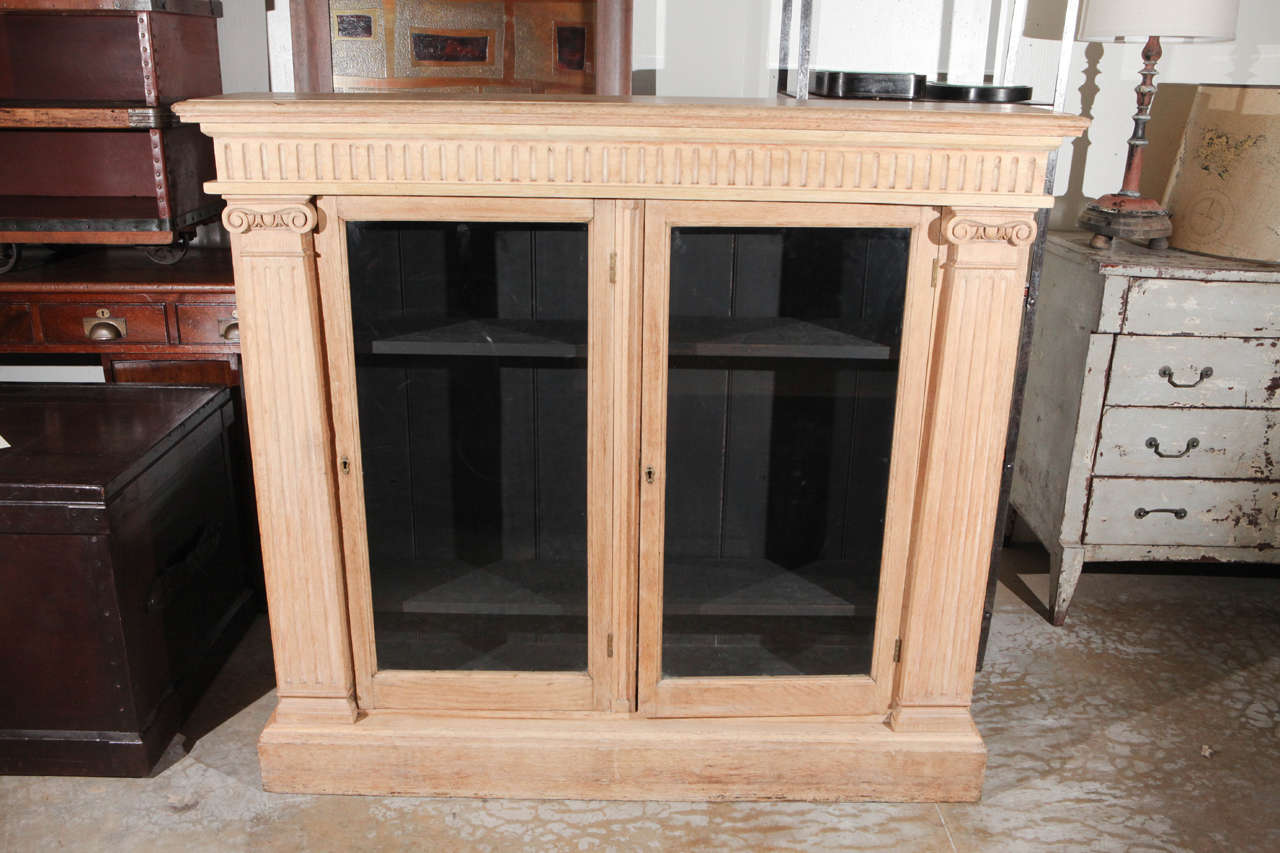 Late 19th century English oak bookcase with glass doors. 