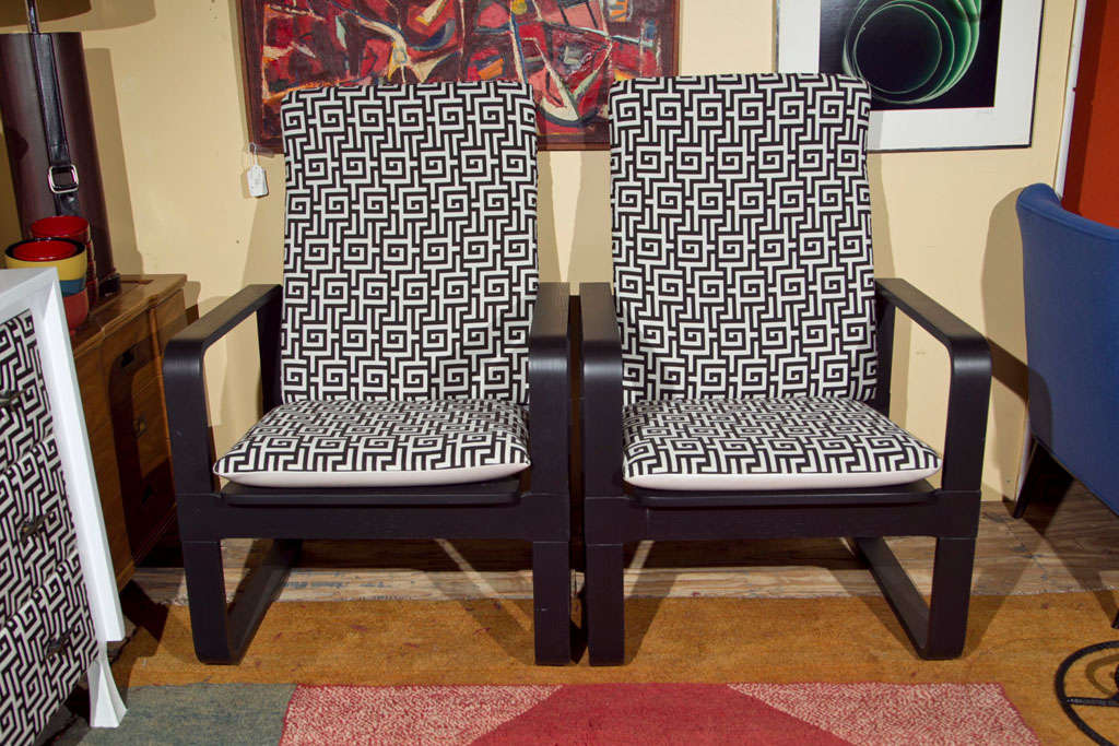 Black lacquered pair of chairs designed by Michael Thonet, covered in black and white Greek key tapestry. Solid black back with white horizontal stripe.