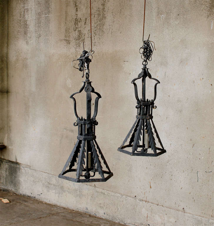 A wonderful painted pair of French Iron lanterns that have been wired for the US.