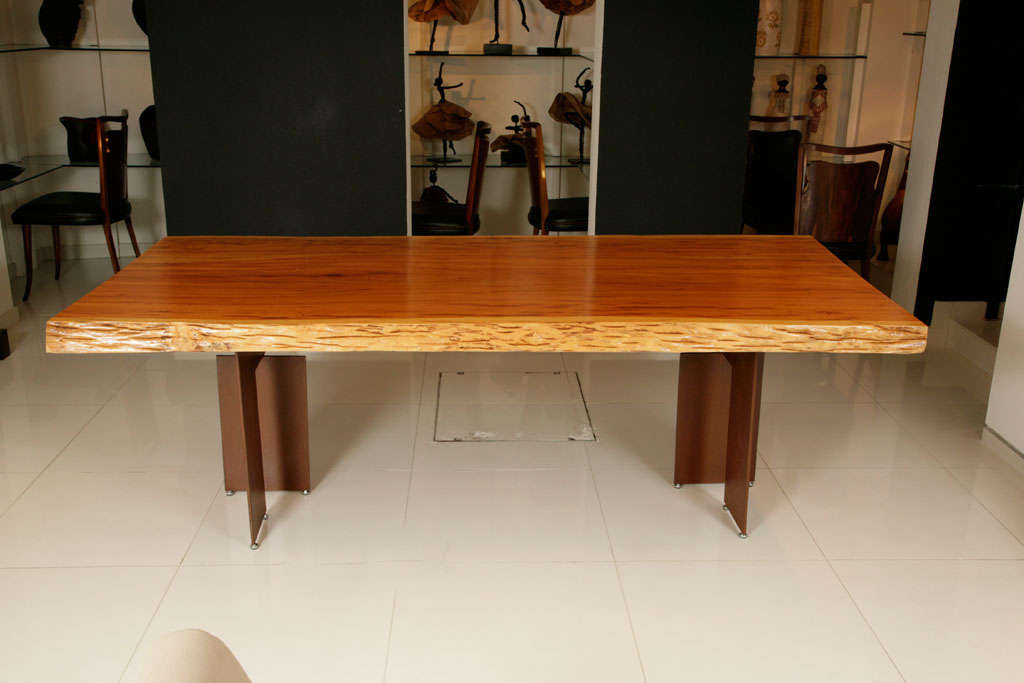 This is a beautiful solid wood tabletop on oxidised iron legs.