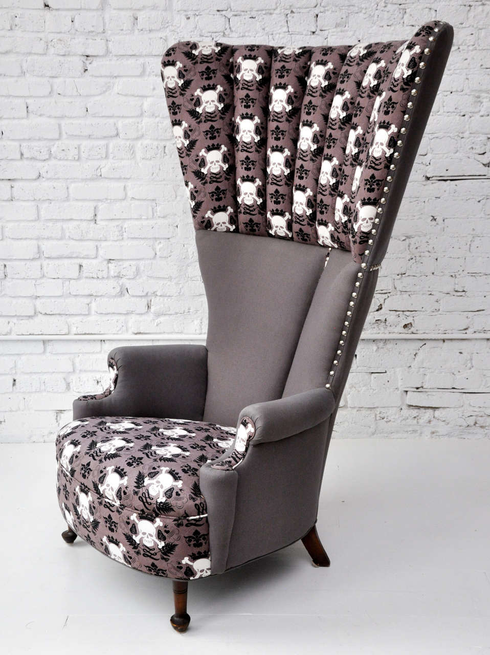 Spectacular and unforgettable one-of-a-kind high-back channel-upholstered wingback chair with tight seat and semi-cabriole front legs, upholstered in a combination of discreet charcoal-brown linen and a print featuring calligraphic scrolls,