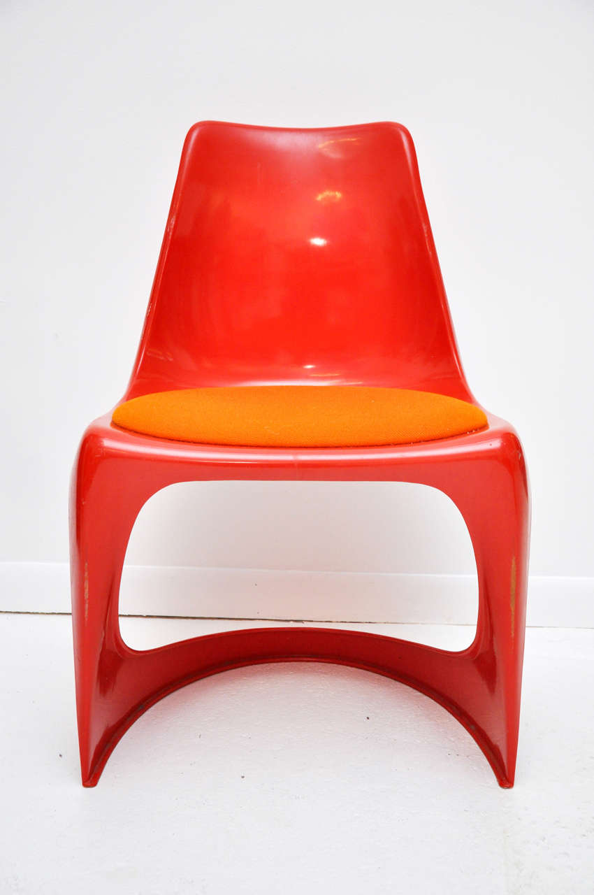 One of the iconic designs of the Mod Era, Steen Ostergaard's molded plastic chair of 1966 was soon on everyone's must-have list.  Eero Saarinen's classic pedestal-base Tulip chair has an even purer visual grace, but Ostergaards's design has several
