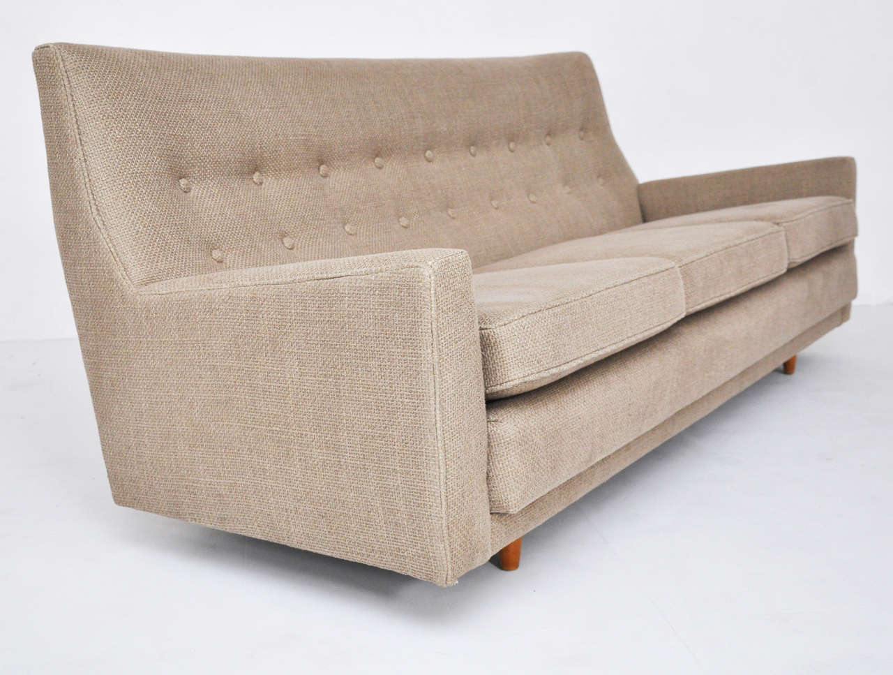 Early and rare sofa by Jens Risom. High back sofa with great lines. Newly upholstered in great Plaines fabric.