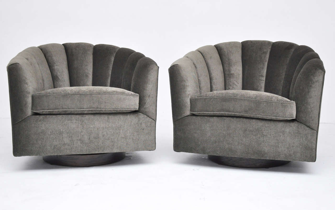Mid-Century swivel chairs. Fully restored dark walnut bases. Newly upholstered.