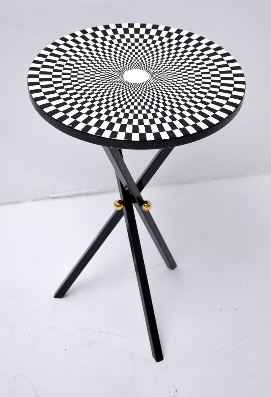 Piero Fornasetti side table.  Lithographic-transfer printed and lacquered wood.  Signed with manufacturer’s mark to bottom 