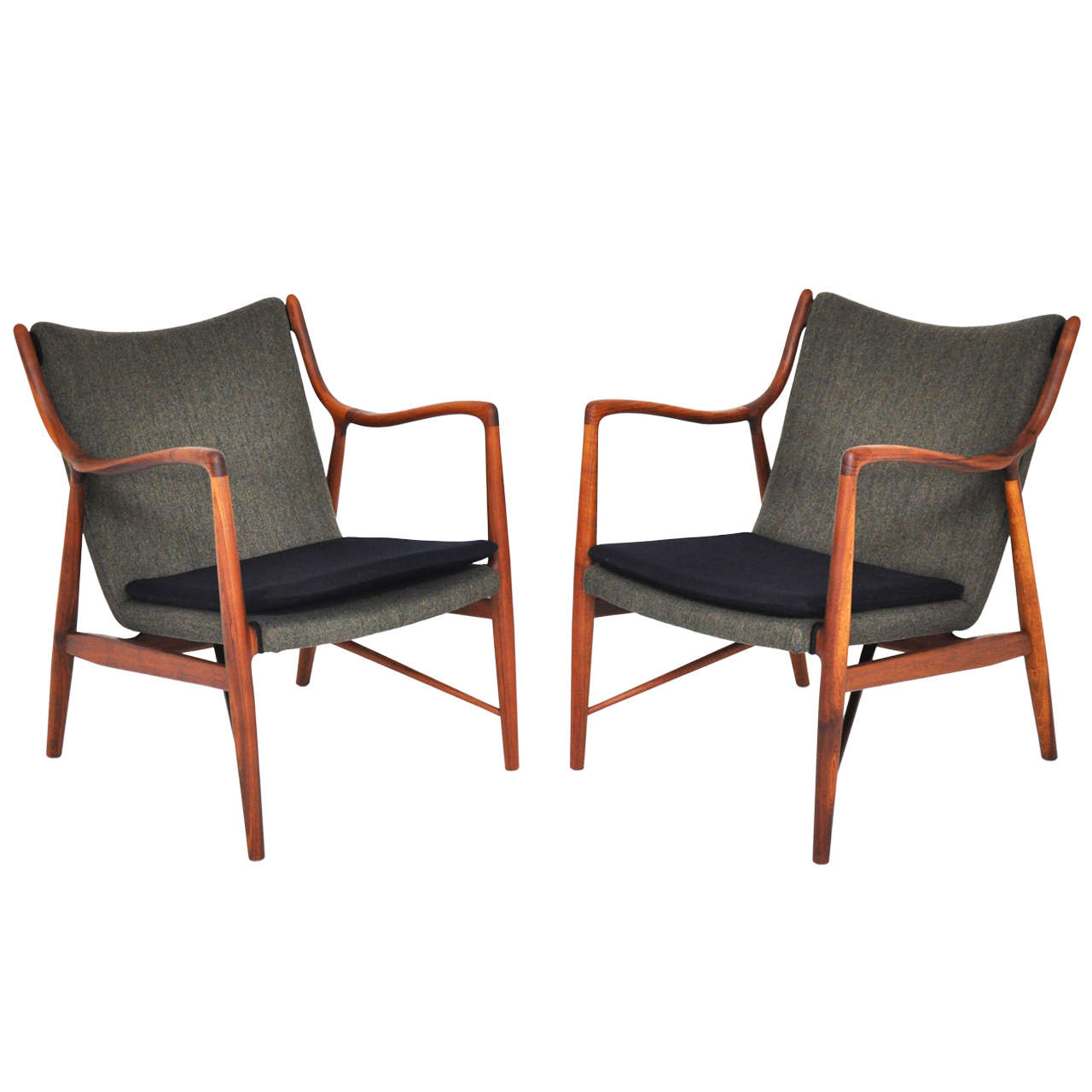 Model 45 chairs designed by Finn Juhl and produced by Baker.  Fully restored.  Natural walnut frames with oil rubbed finish.  New wool upholstery.