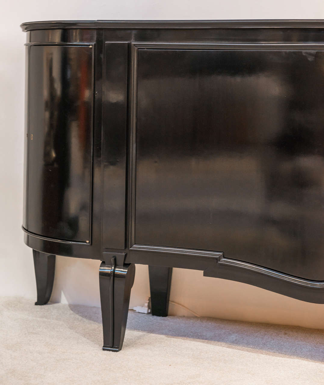 An exceptional ebonized wood sideboard by Andre Arbus (1903-1969), with a beautifully executed patinated bronze, sculpted head of Medusa, by Vadim Androsov (1895-1975) mounted at the center.
France, circa 1938.
Provenance: Private collection,